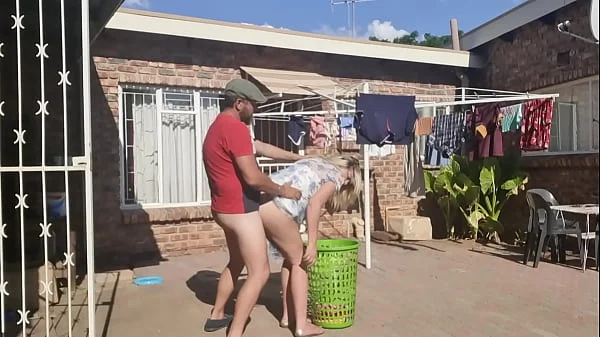 Outdoor fucking while taking off the laundry